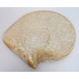 A Chinese export abalone shell carved allover with numerous figures, buildings, trees, foliage and a