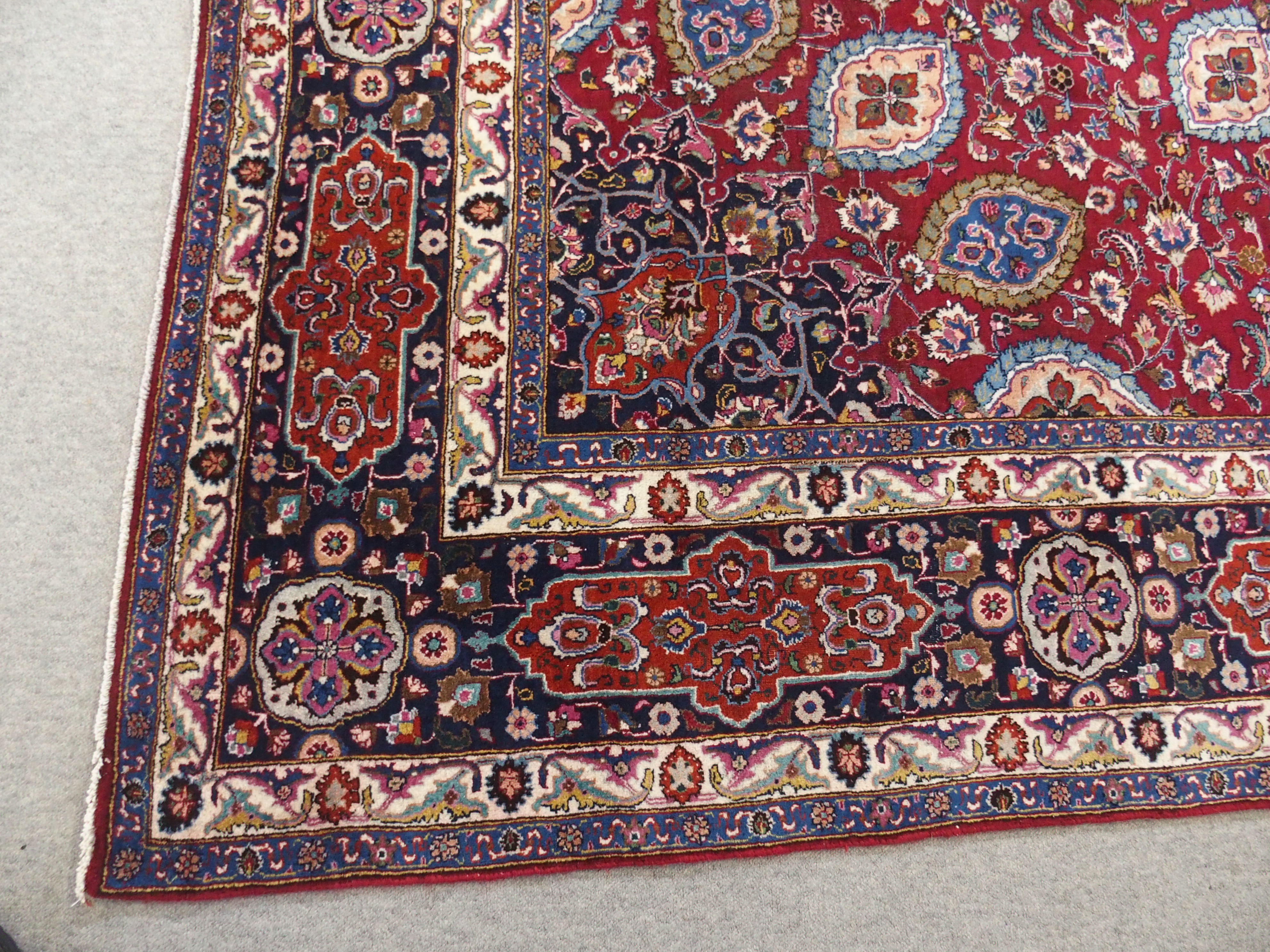 A red ground meshed rug with a blue central medallion and border, 370 x 294cm - Image 9 of 10