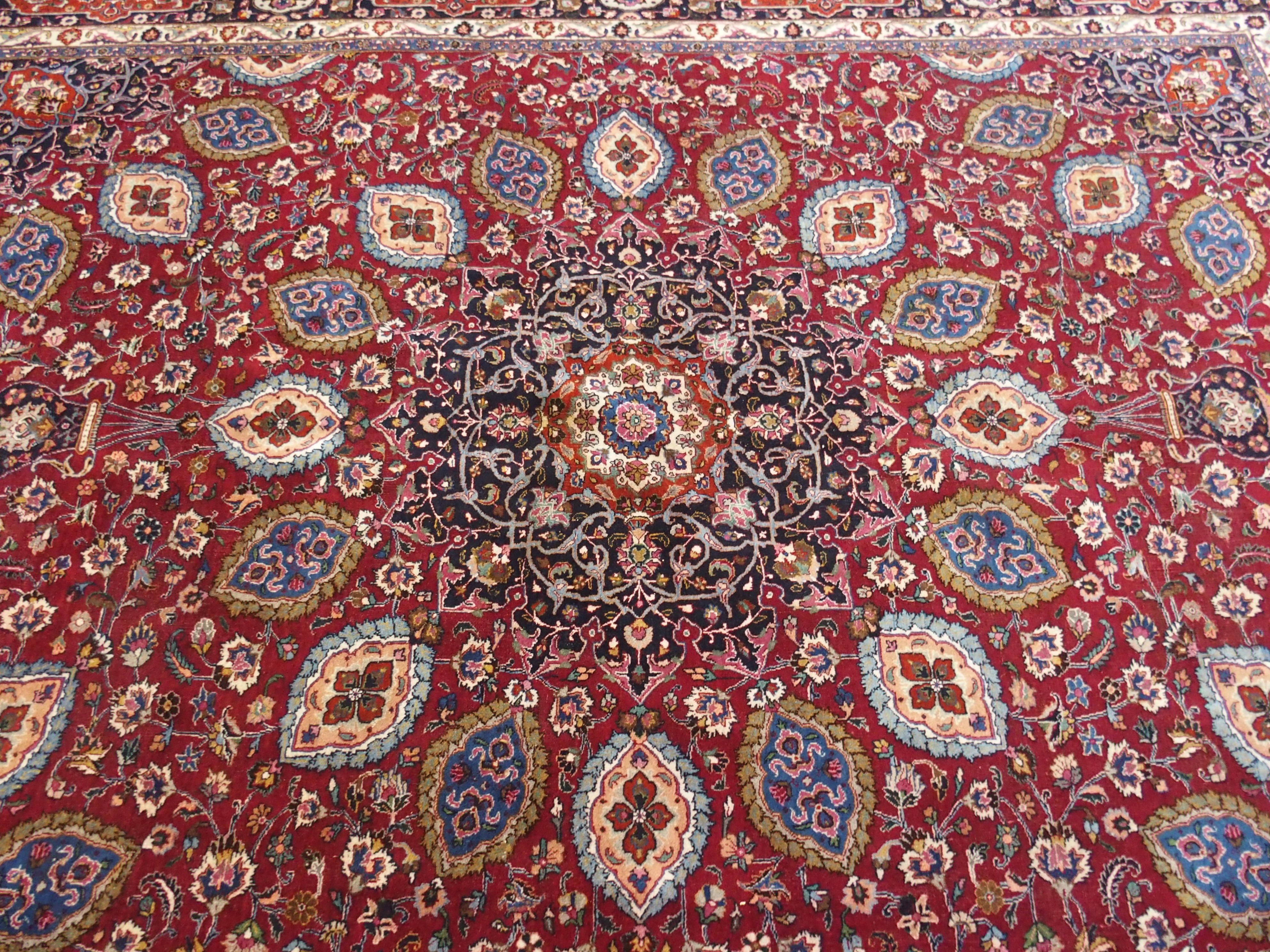 A red ground meshed rug with a blue central medallion and border, 370 x 294cm - Image 4 of 10
