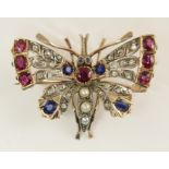 A pretty butterfly brooch set with diamonds, rubies, sapphire and pearls to a handmade yellow and