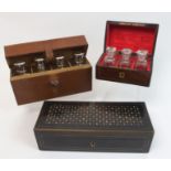 A mahogany brass and mother of pearl inlaid scent bottle box the fitted interior with three glass