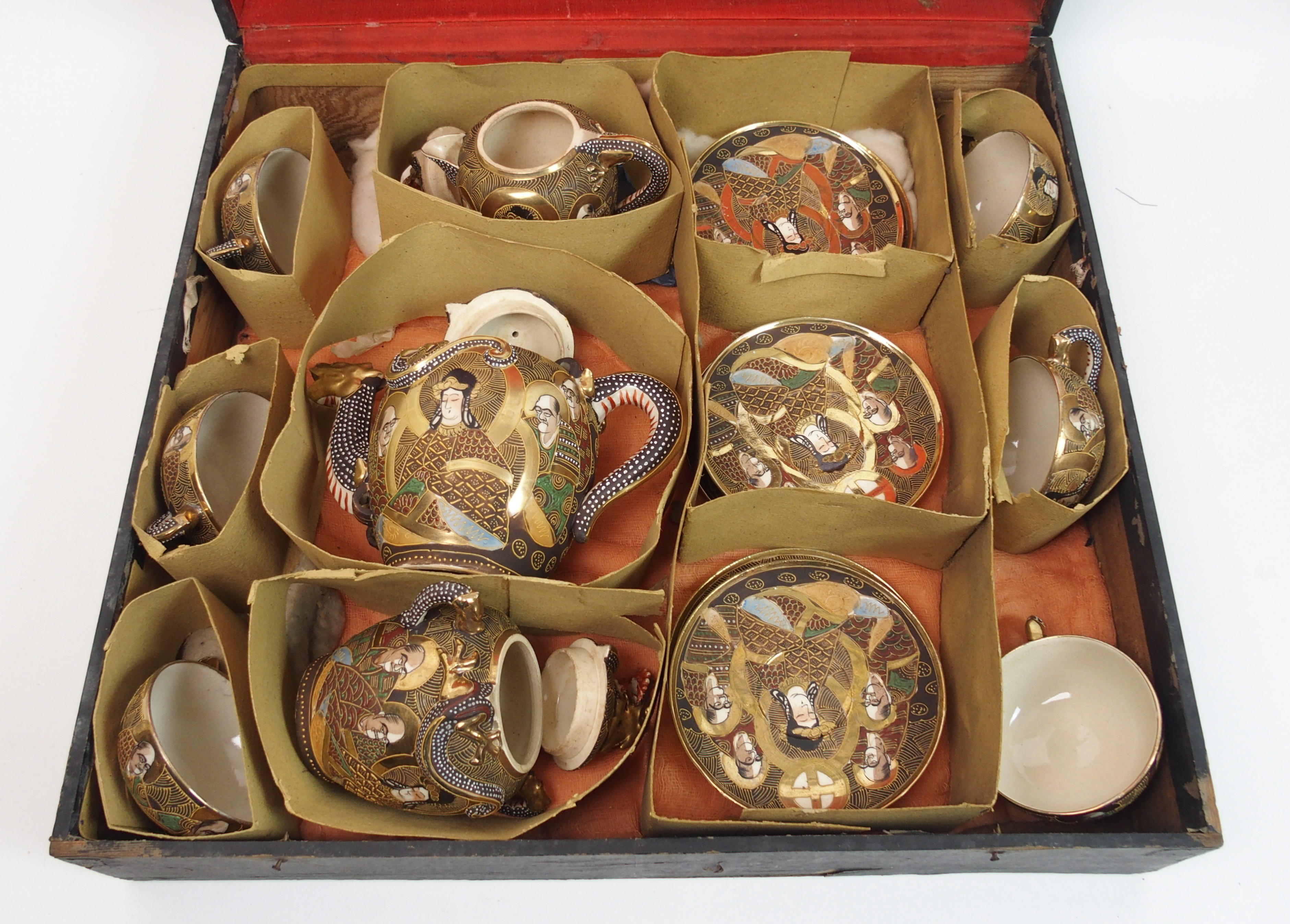 A Satsuma cased teaset painted with Kannon and Rakan, comprising; teapot, sugar bowl, cream jug, six