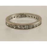 An 18ct white gold full eternity ring set with approximately 1.35cts of brilliant cut diamonds,