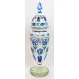 A 19th Century Bohemian overlaid glass vase and cover overlaid white over blue, cut with circular