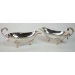 A pair of sterling silver sauceboats maker's name obscure, marked sterling 925, with gadrooned