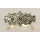 A 14ct gold linear diamond cluster ring the brilliant cut and baguette cut diamonds have an