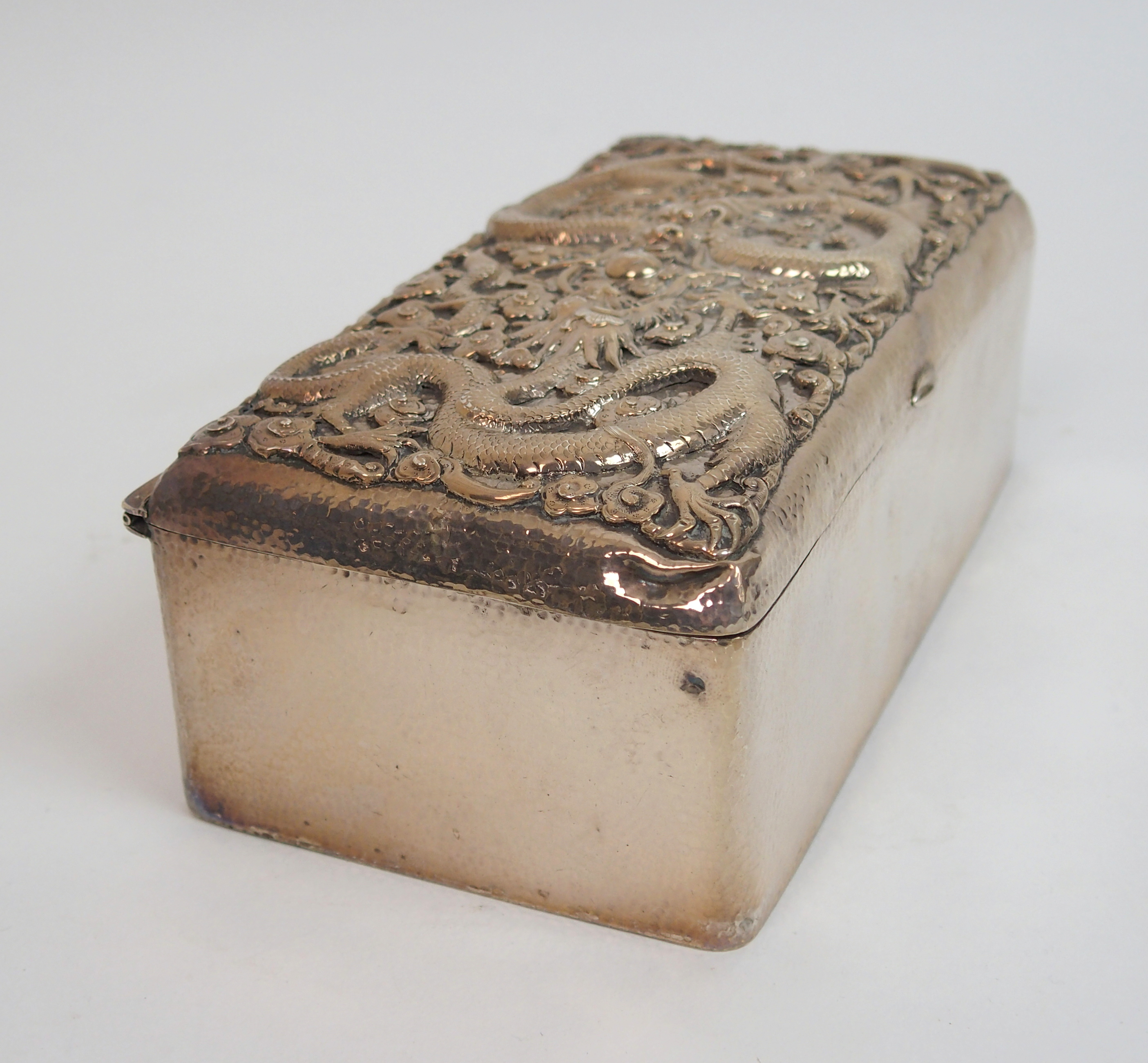 A Chinese silver hammered rectangular cigar box the hinged cover decorated with two facing dragons - Image 3 of 10