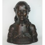 A Robert McKean (Active 1909 - 1913) patinated plaster bust of a girl titled WINNIE, with incised