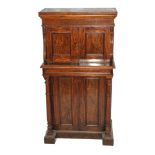 A Victorian rosewood collector's cabinet with a pair of doors enclosing twelve drawers beneath a