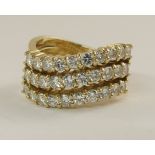 A triple row diamond wave ring brilliant cut diamond content approx 1.50cts in total, finger size