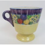 Mary L Fairgrieve (1875-1969) A pottery mug the mainly yellow ground with hand painted band of