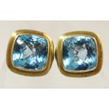 A pair of blue topaz silver and 18ct gold detail earrings by David Yurman a very popular American