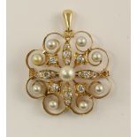 An Edwardian diamond and pearl pendant brooch manufactured throughout in bright yellow metal with