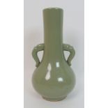 A Celadon two-handled baluster vase applied with animal mask scroll handles (foot rim chip), 23.