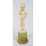 A Ferdinand Preiss (German 1882-1943) Standing Boy carved ivory figure, modelled blowing a pipe,