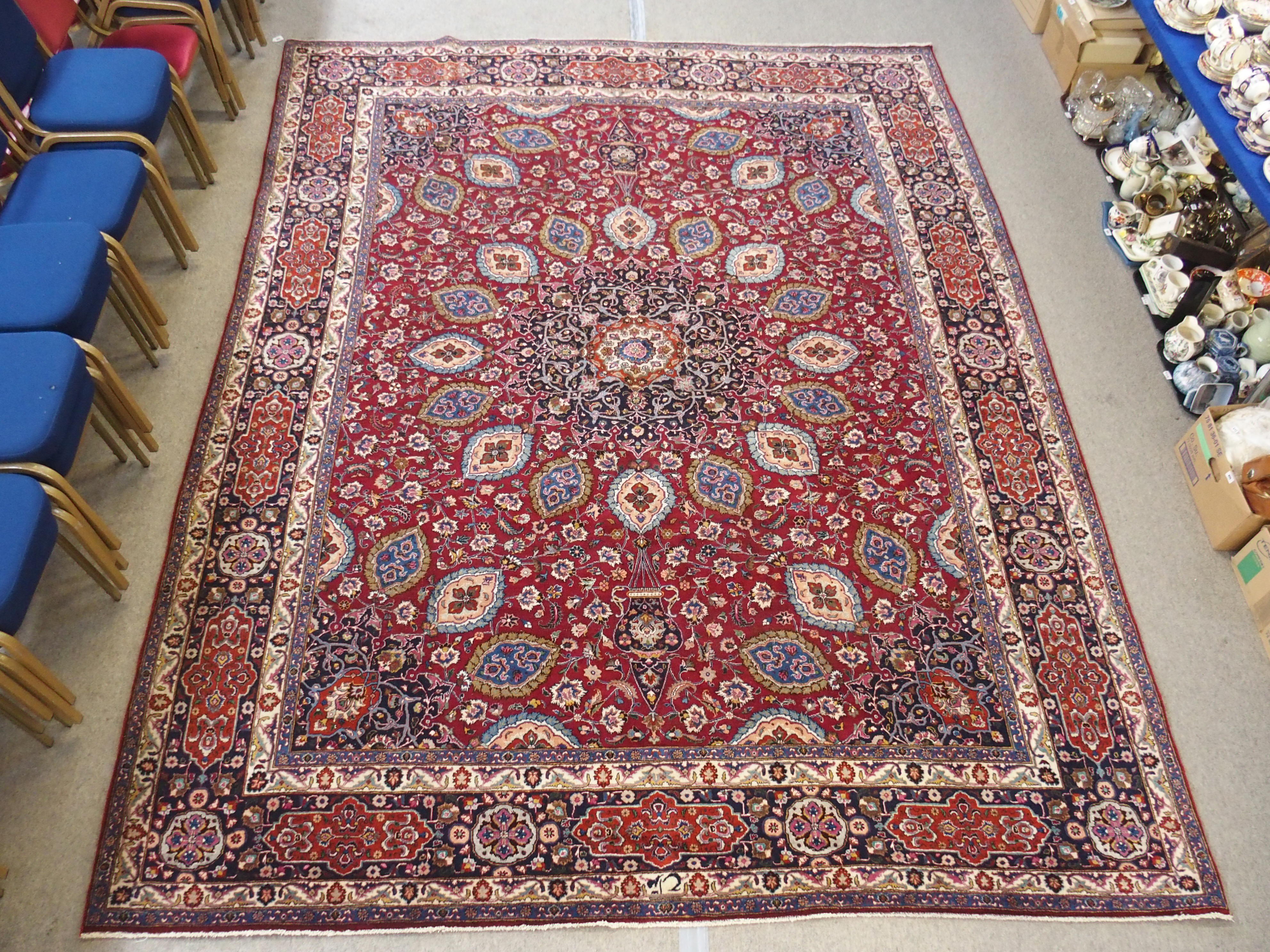 A red ground meshed rug with a blue central medallion and border, 370 x 294cm - Image 2 of 10