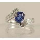 An 18ct white gold sapphire and diamond dress ring the central oval cut sapphire of approx 1.35cts