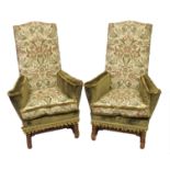 A pair of Queen Anne style upholstered wing armchairs in floral needlework and green velvet on