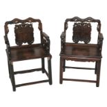 A pair of Chinese hardwood armchairs the backs carved with four characters beneath peach branches,