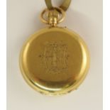 An 18ct gold small pocket watch with engraved monogram to the front, white enamelled dial with black