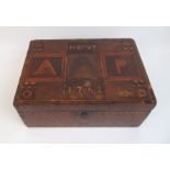 An 18th Century marquetry inlaid lap desk inlaid with varying squares and triangles, the lid with