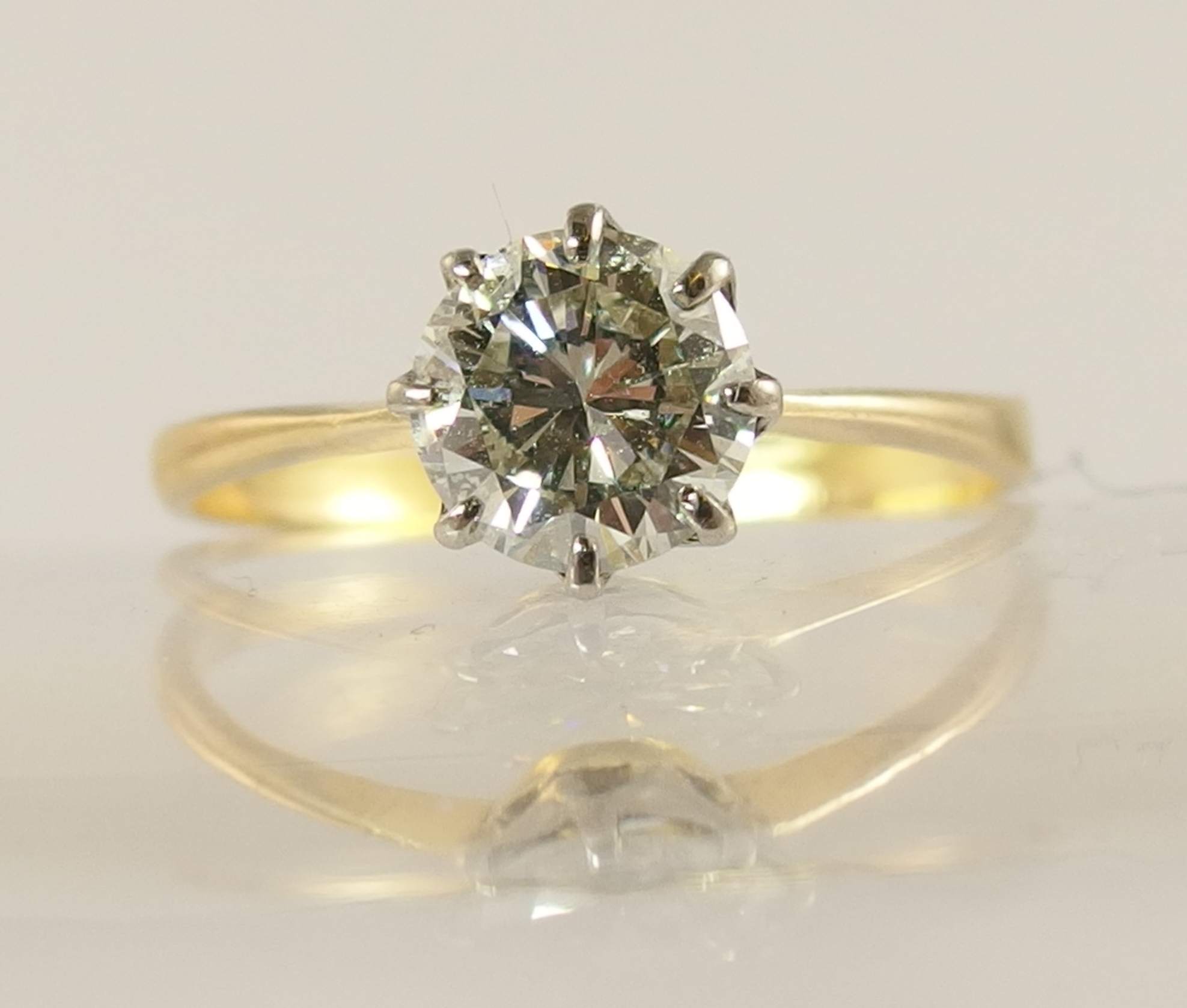 A 1.12ct diamond solitaire ring with classic crown mount in white metal with a tapered yellow - Image 3 of 6