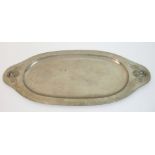 A Glasgow style Art Nouveau white metal tray decorated with stylised moths or dragonflies, with