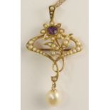 An Art Nouveau flower pendant brooch of classic whip lash design set with an amethyst and split