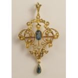 A 15ct gold aquamarine and pearl Edwardian pendant brooch the floral Art Nouveau form set with split