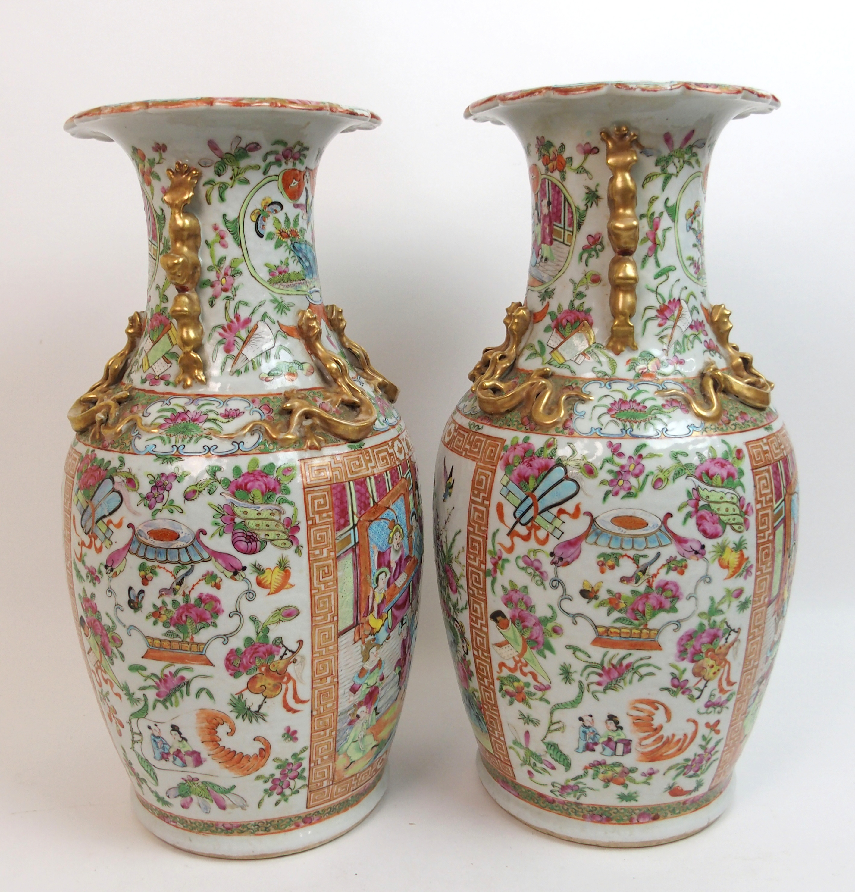 A pair of Canton famille rose baluster vases panted with large panels of mandarins holding court - Image 2 of 10