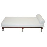 A Philippe Starck Neoz day bed the mahogany frame supporting white linen upholstery and on plastic