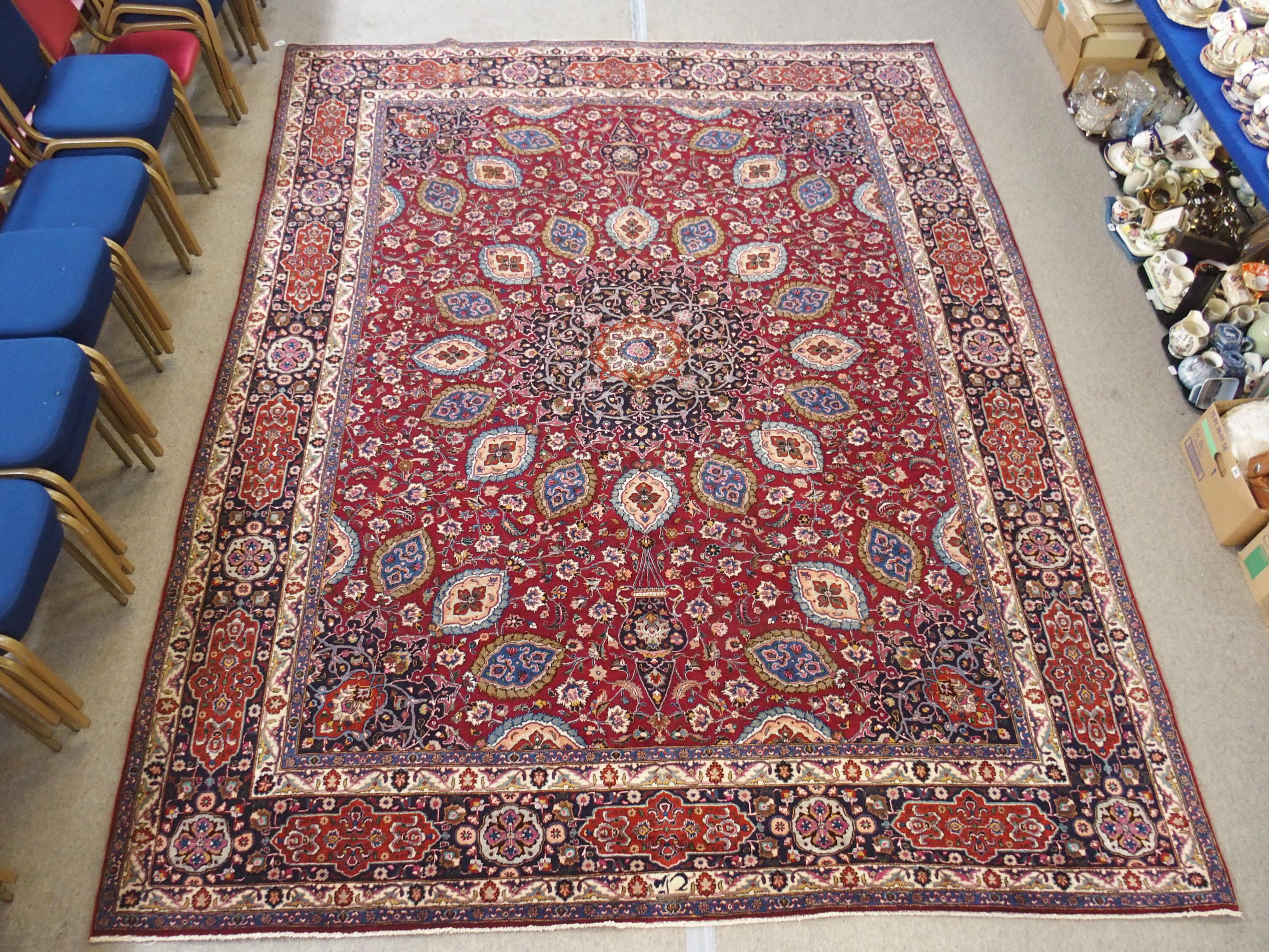 A red ground meshed rug with a blue central medallion and border, 370 x 294cm - Image 3 of 10