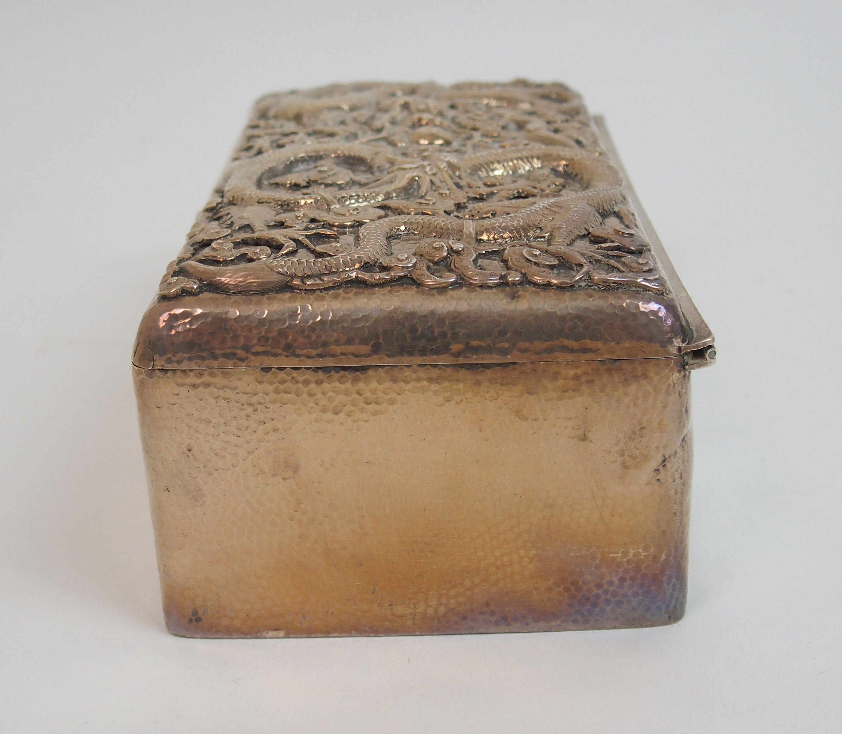 A Chinese silver hammered rectangular cigar box the hinged cover decorated with two facing dragons - Image 5 of 10