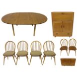 An Ercol dining room suite comprising; an oval extending table, 137 x 108cm, sideboard with three