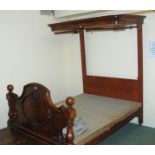 A Victorian mahogany half tester double bed with carved footboard