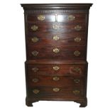 A George III mahogany chest on chest the dentil over-hanging cornice above a fretwork band with