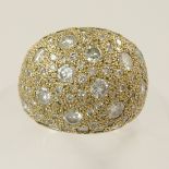 A diamond set statement ring the whole surface of this yellow metal dome shaped ring is set with