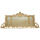 A Chippendale style triple plate giltwood overmantel mirror carved with scrolling foliage joined