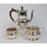 A silver coffee pot and sugar bowl by Fenton, Russell & Co. Limited, London 1938, of cylindrical and