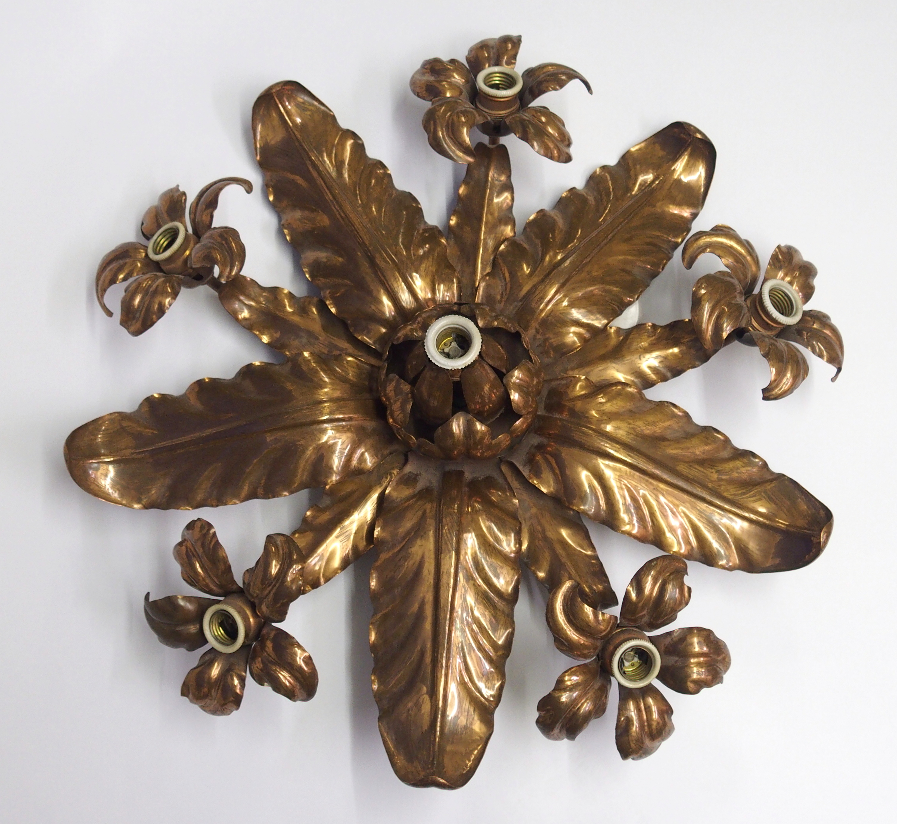An Arts and Crafts copper ceiling light the electric ceiling light of radiating leaf form with