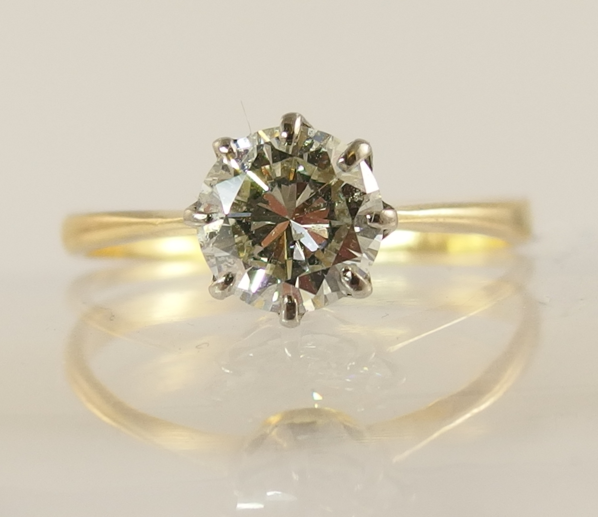 A 1.12ct diamond solitaire ring with classic crown mount in white metal with a tapered yellow - Image 4 of 6