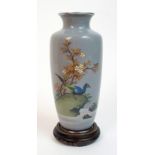 A Japanese cloisonne baluster vase decorated with a pheasant on a rock beneath blossoming branches