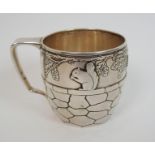 A sterling silver nursery tankard by Tiffany & Co., of barrel shape with looping handle, the body