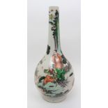 A Chinese famille verte bottle vase painted with a figure in a sampan approaching two men on a
