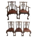 A set of eight Chippendale style mahogany dining chairs with vase shaped pierced back splats above