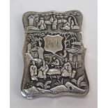 A Chinese white metal card case decorated with figures and bamboo, with shield initialled medallion,