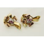 A pair of 14ct gold ruby and diamond ear clips in a two colour gold bow design, dimensions 2.7cm