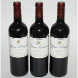 Three bottles of Chateau Belingard 2007 in presentation chess set box with corkscrews, bottle