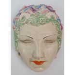 A Clarice Cliff 'Pan' mask wall pocket moulded in relief and painted with colours, printed mark to