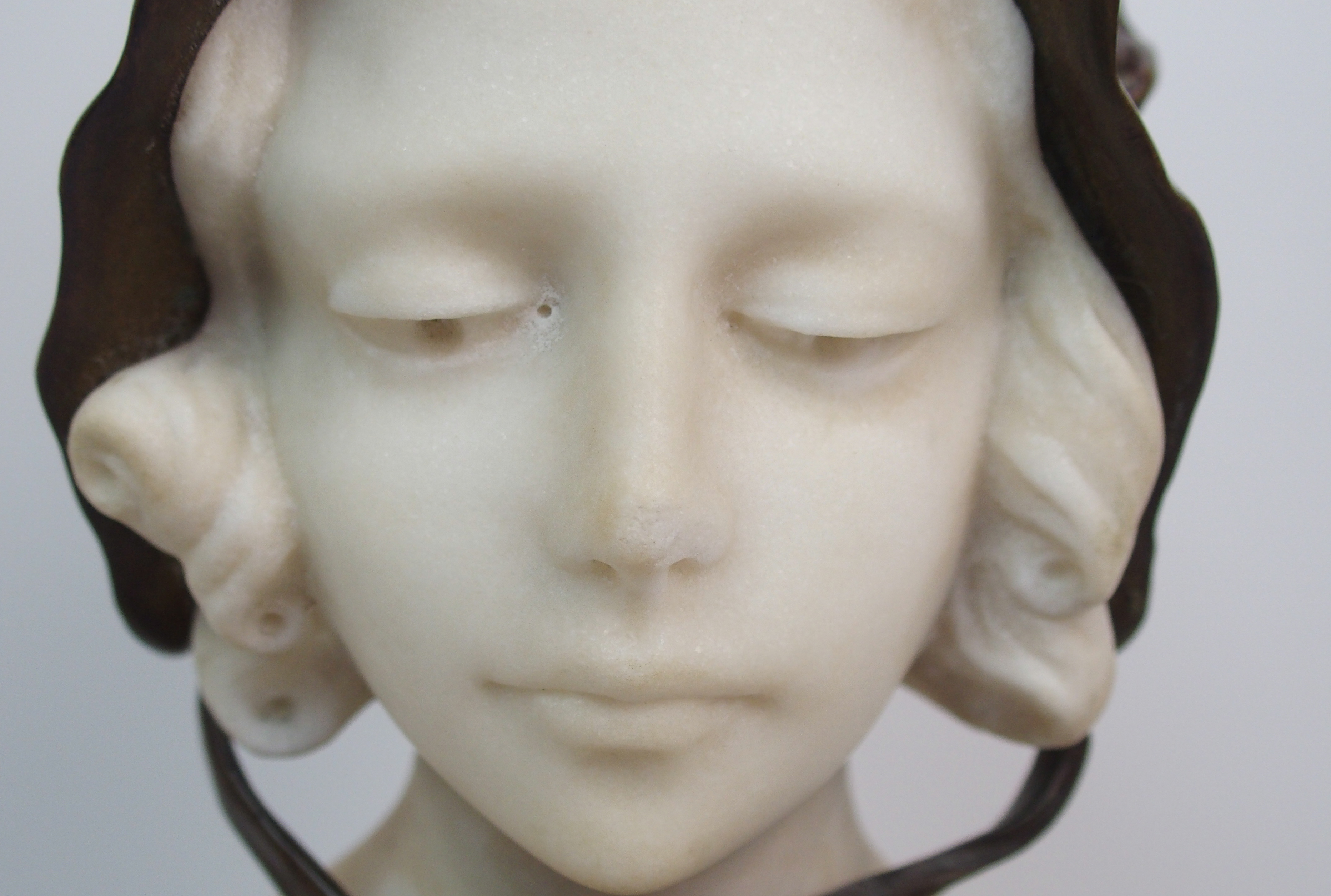 Affortunato Gory (active 1895-1925) Bronze and alabaster bust of a girl modelled wearing a bonnet, - Image 3 of 10